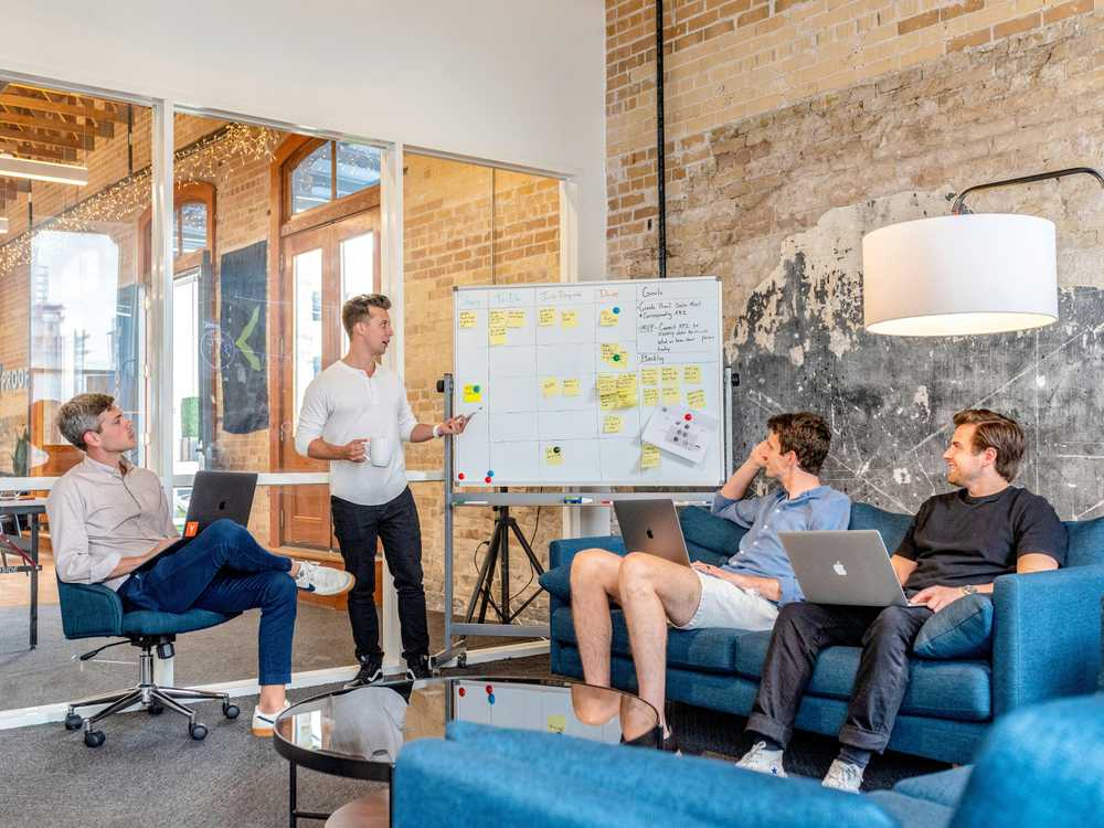 Four people in a meeting