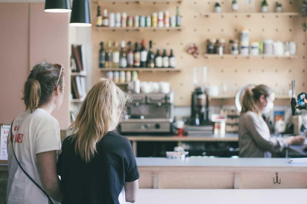 People waiting at coffee bar