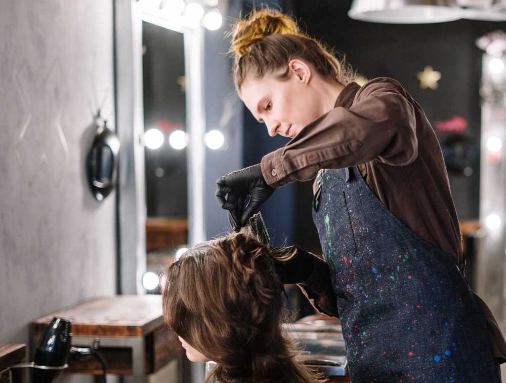 Hairstylist cutting hair